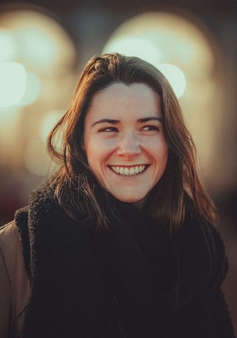 Portrait of a smiling woman in warm, natural light