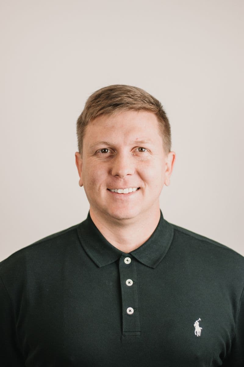 Portrait of a smiling man in a polo shirt
