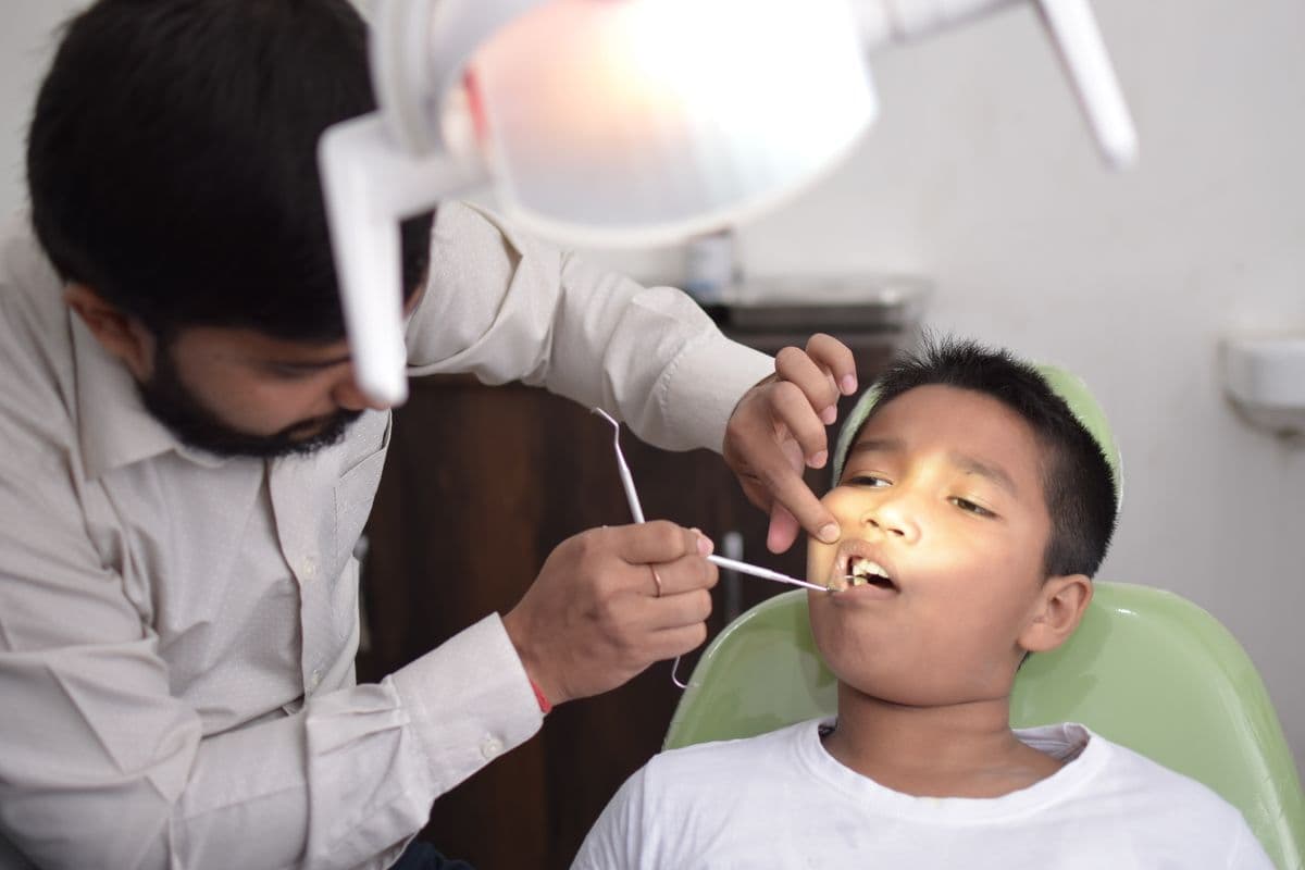 A child smiling in soft natural light