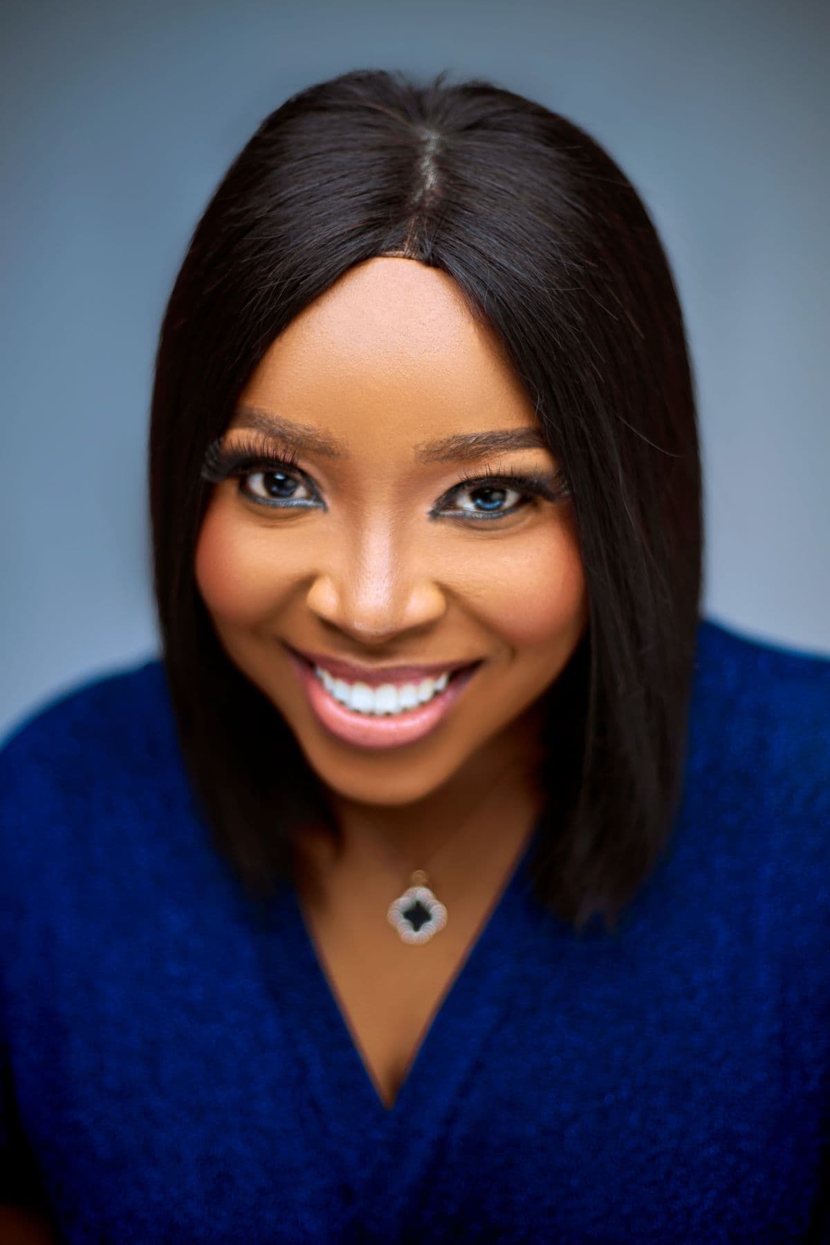A woman smiling confidently with a bright, straight smile